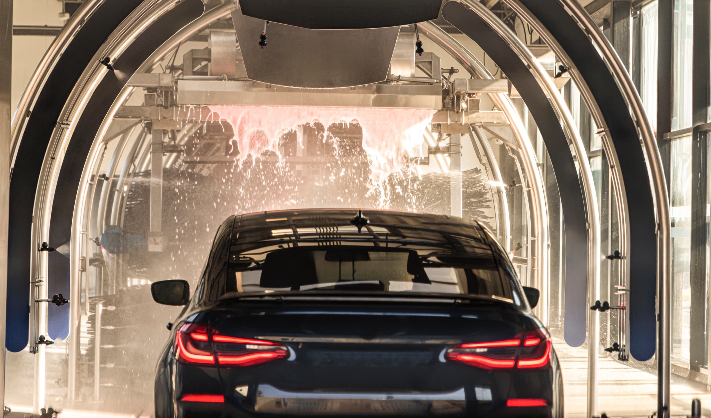 A car moving through an automatic wash tunnel